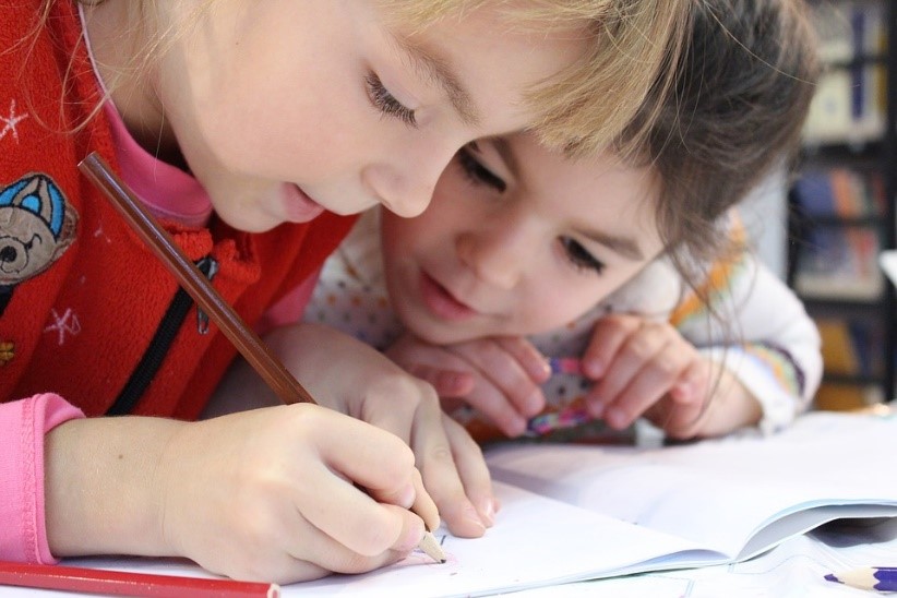 Two children working on a written task
