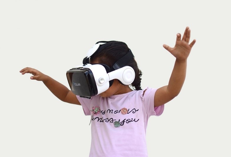 A child wearing a VR headset