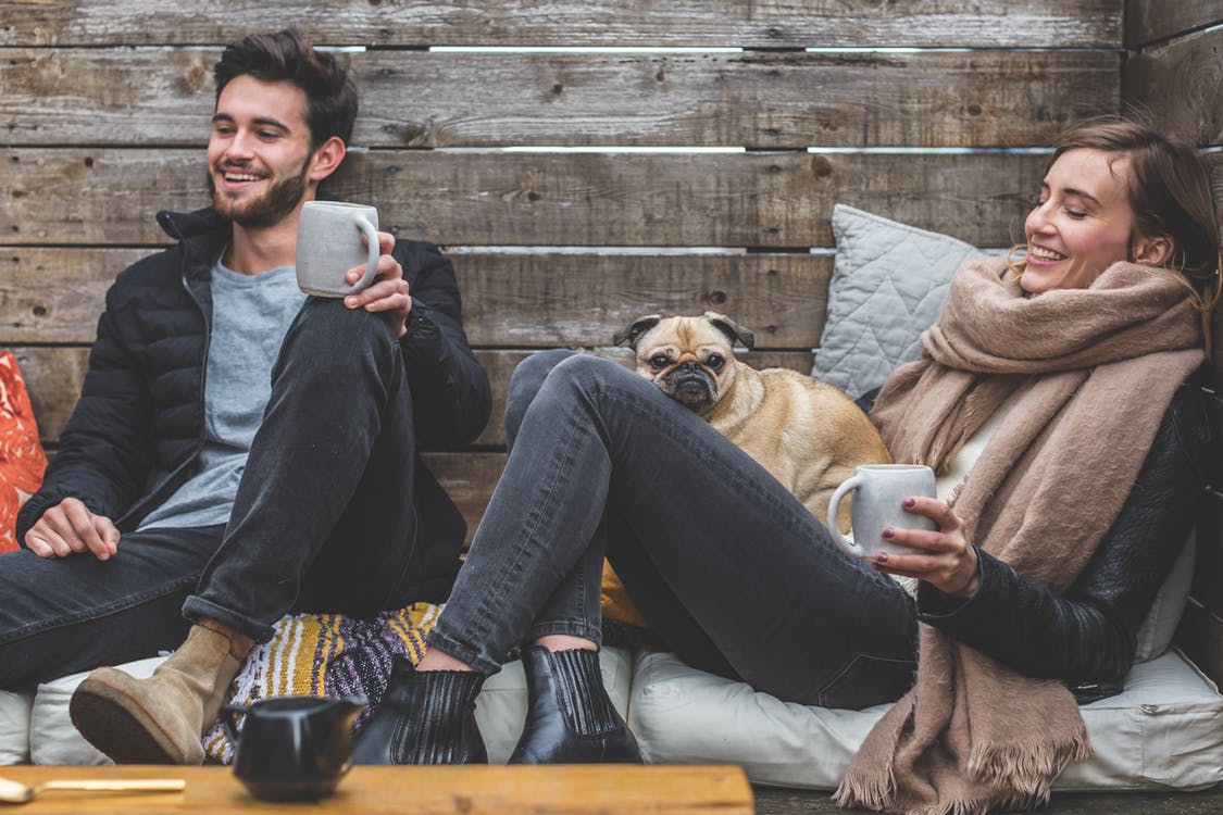 A man and a woman laughing together 