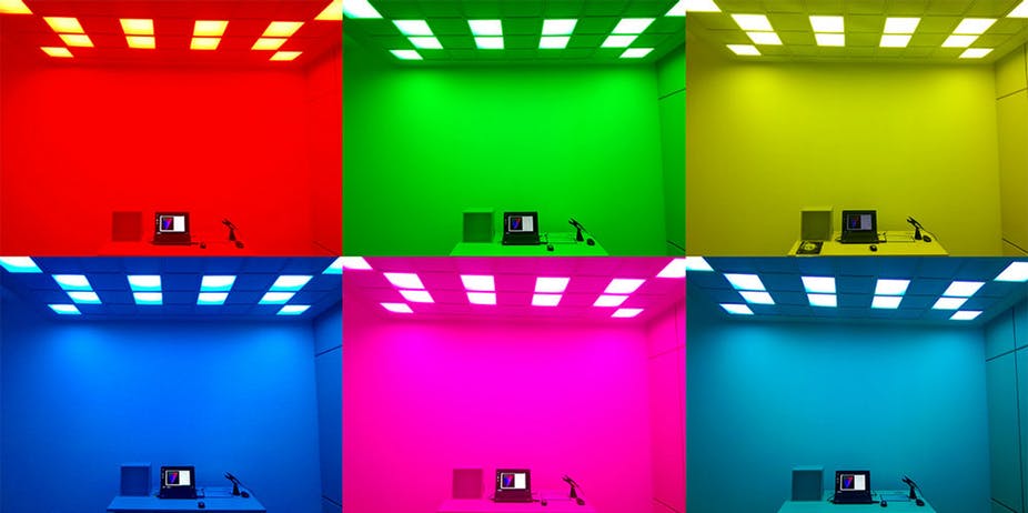 The same room but lit up in six different colours.