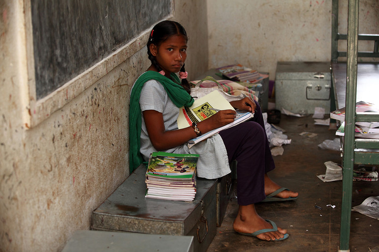 An Indian school girl with books