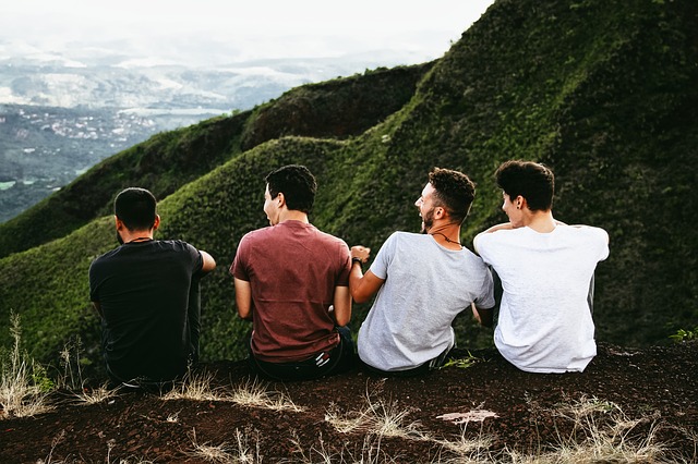 Group of four friends on a mountain