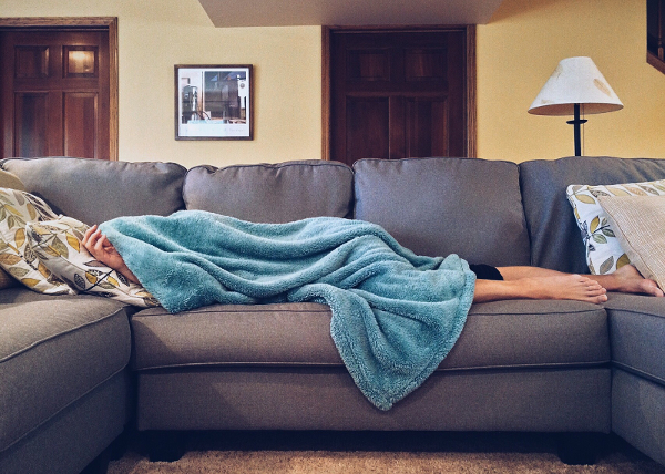 Person sleeping on a sofa